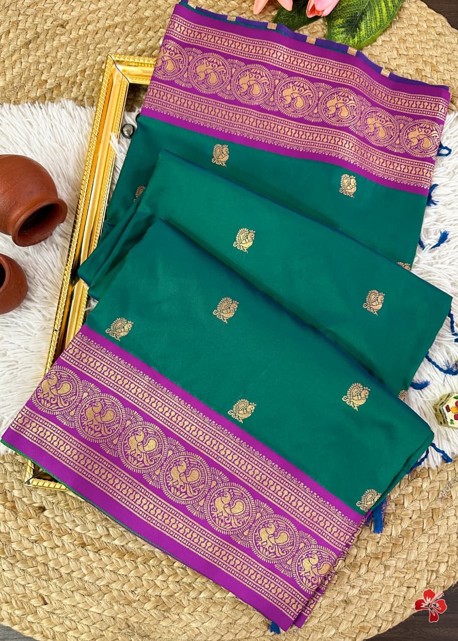 *semi kanjivaram soft silk sarees* that is inspired from pure silk kanjivaram sarees👗Having all over *Annam butties in the body contrast woven border and grand woven pallu with exclusive tassels*🧶Pairs with *contrast woven blouse*🧵