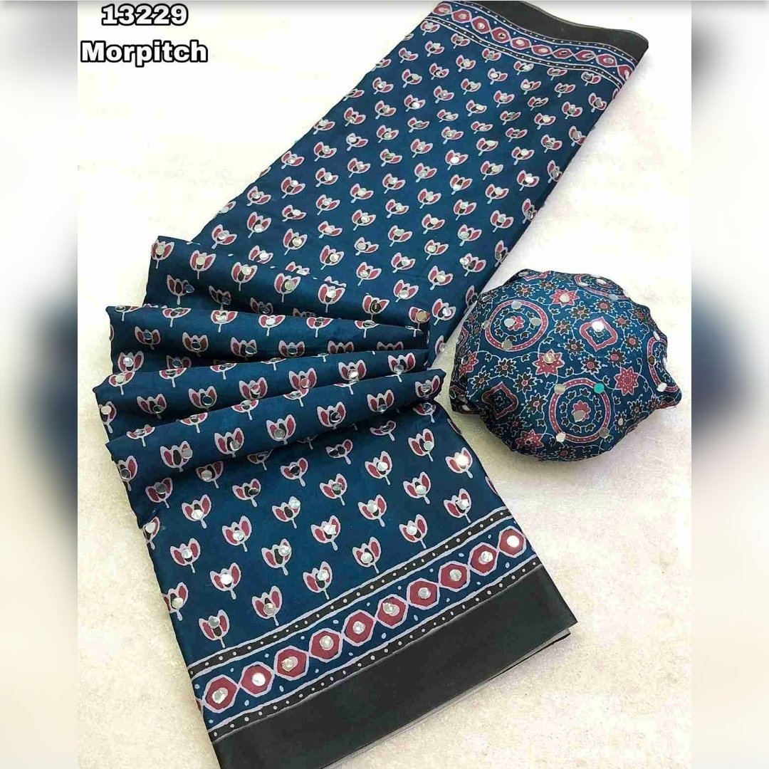 Fabric - Soft & smooth satin crape silk ajrakh digital printed saree with original mirror work (3500 mirror) Blouse - printed mirror work blouseSaree cut - 5.5 meter Blouse cut - 0.8 meterAvailable in 9 colours Weight - 990 Grams