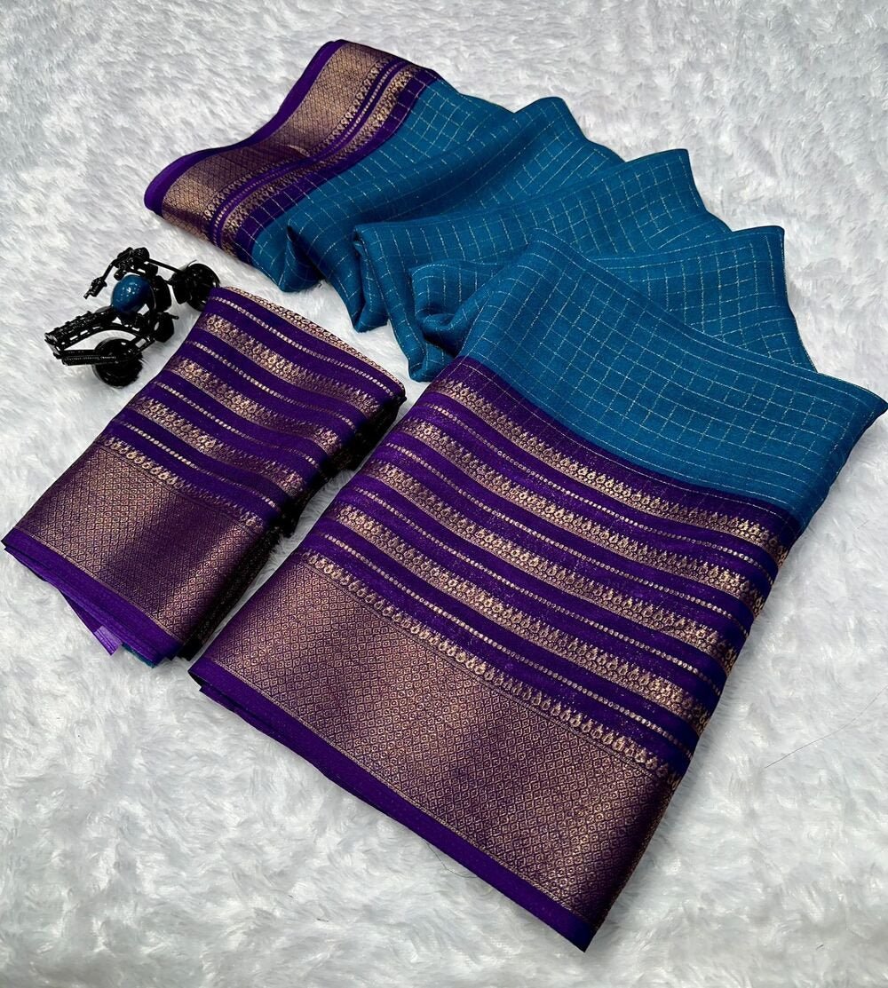 Mysore crepe silksSoft mysore crepe with zari chex pattern and contrast zari lining concept border with contrast crepe blouse Soft n flowy material, very comfortable to wear