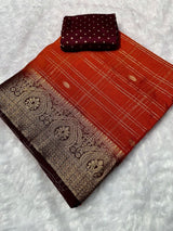 Kanjivaram silk saree with zari chex and contrast dyed zari borderComes with contrast dyed lining zari pallupaired with viscose silk blouse