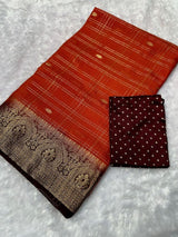 Kanjivaram silk saree with zari chex and contrast dyed zari borderComes with contrast dyed lining zari pallupaired with viscose silk blouse