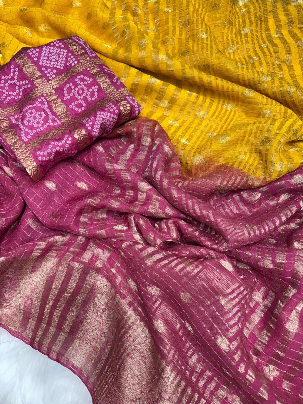 Chinnon crape silk with zari weaving border either side and lining zari pallu as shownWith rich zari weaving butties all over saree with chex weaving in bodyIn 2d shaded colour conceptAnd Bandhini weaving blouse