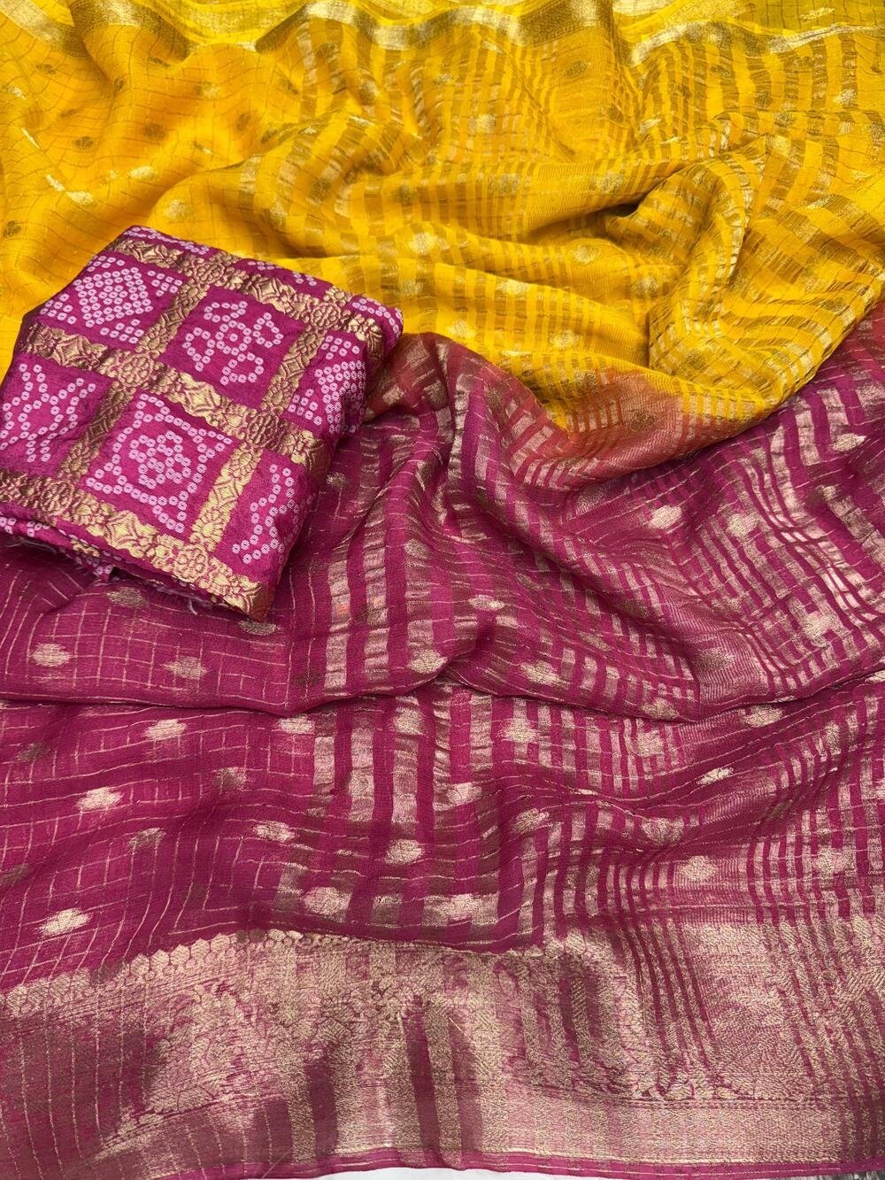 Chinnon crape silk with zari weaving border either side and lining zari pallu as shownWith rich zari weaving butties all over saree with chex weaving in bodyIn 2d shaded colour conceptAnd Bandhini weaving blouse