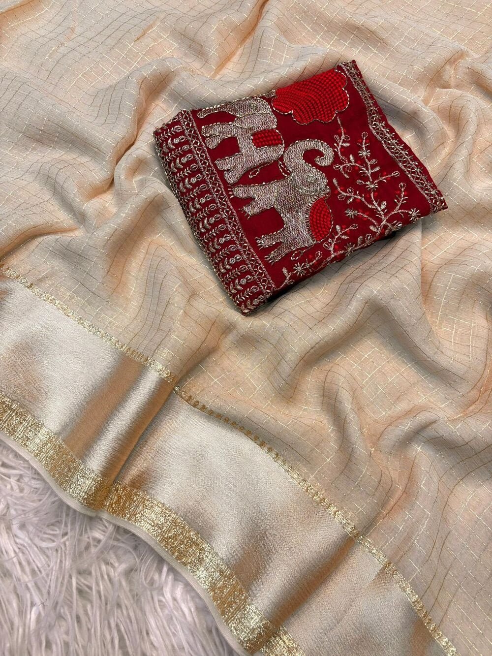 Georgette ChexViscose Georgette saree with zari chex weaving all over Saree and satin borderComes with contrast marron colour beads embroidery work Blouse