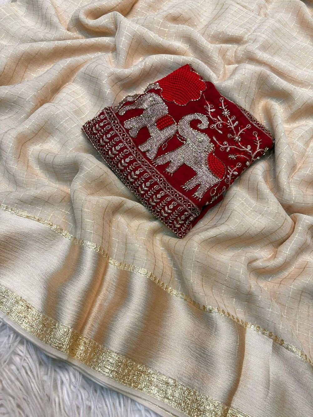 Georgette ChexViscose Georgette saree with zari chex weaving all over Saree and satin borderComes with contrast marron colour beads embroidery work Blouse