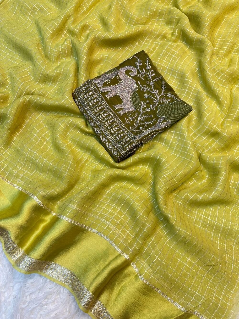 Georgette ChexViscose Georgette saree with zari chex weaving all over Saree and satin borderComes with contrast marron colour beads embroidery work Blouse