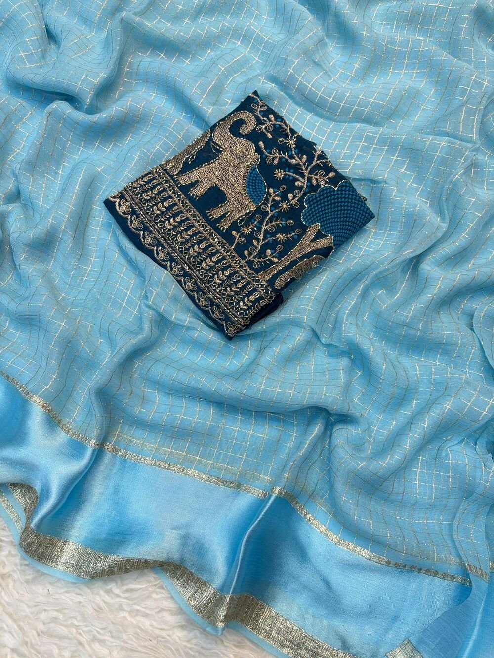 Georgette ChexViscose Georgette saree with zari chex weaving all over Saree and satin borderComes with contrast marron colour beads embroidery work Blouse