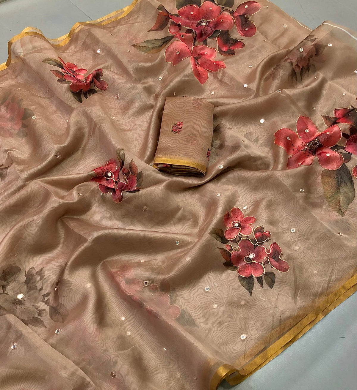 Fabric - Organza Floral Digital Print With Embroidery Zari Outing & Foil Mirror Embroidered With Zari Border Blouse - Printed BlouseSaree cut - 5.5 meter Blouse cut - 0.8 meterAvailable in Single Colour Weight - 310 Grams999/-