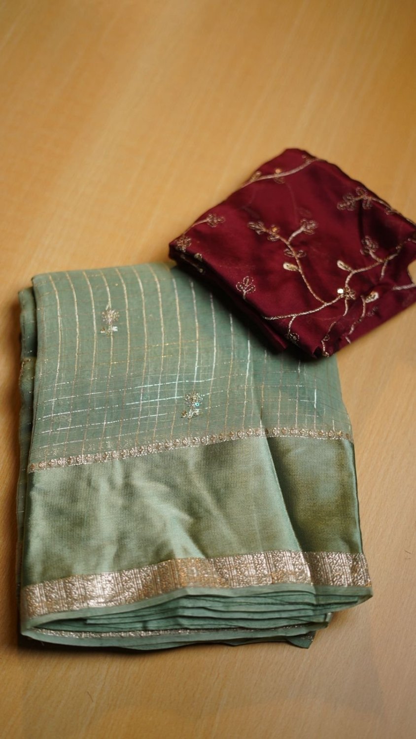 viscose Georgette with all over cheks coming with butti work n sequence work Blouse :-rangoli silk with zari sequence work in all over blouse