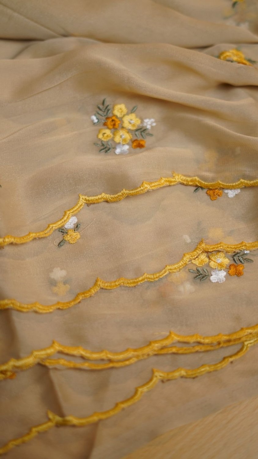 Fabric - Star Georgette Floral Thread Embroidery Work With Scalloped Cutwork Border Blouse - Contrast Embroidery Work BlouseSaree cut - 5.5 meter Blouse cut - 0.8 meterWeight - 550 Grams