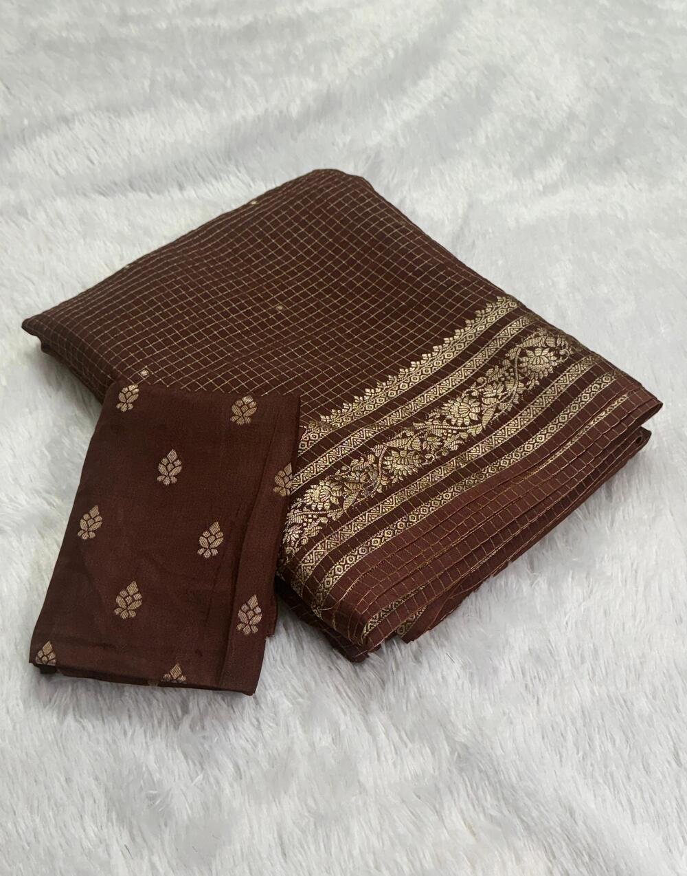 Viscose Russian ChexPure viscose russian chex saree with zari butti all over and zari border both sideswith running Zari lining chitt pallu and viscose jacquard weaving blouse