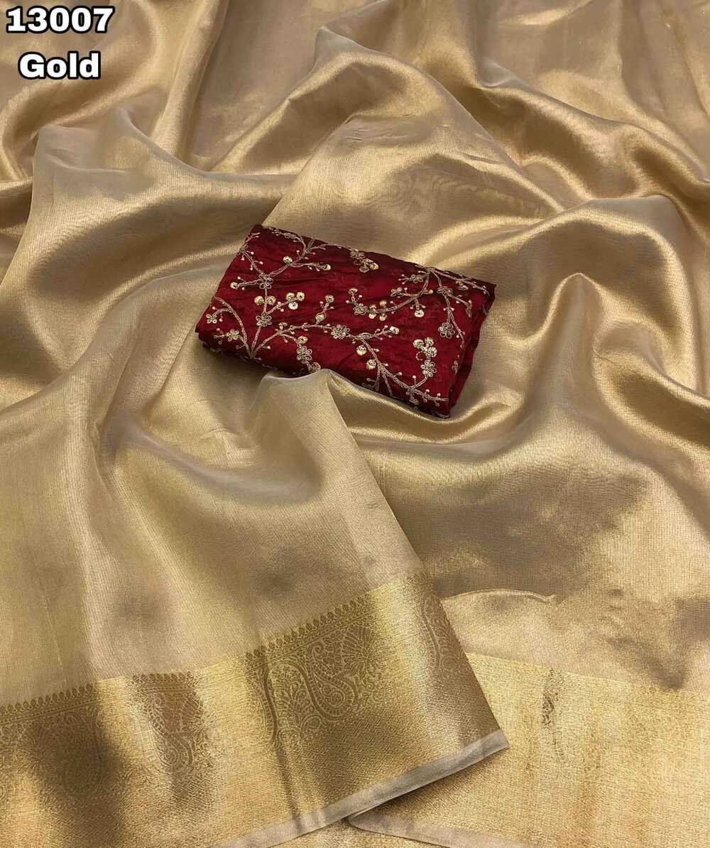 abric - Tissue silk gold zari weaving saree comes with gold colour weaving border & chit pallu Blouse - Rangoli with embroidery & coading work Saree cut - 5.5 meter Blouse cut - 0.8 meter Available in Single colour Weight - 450 Grams