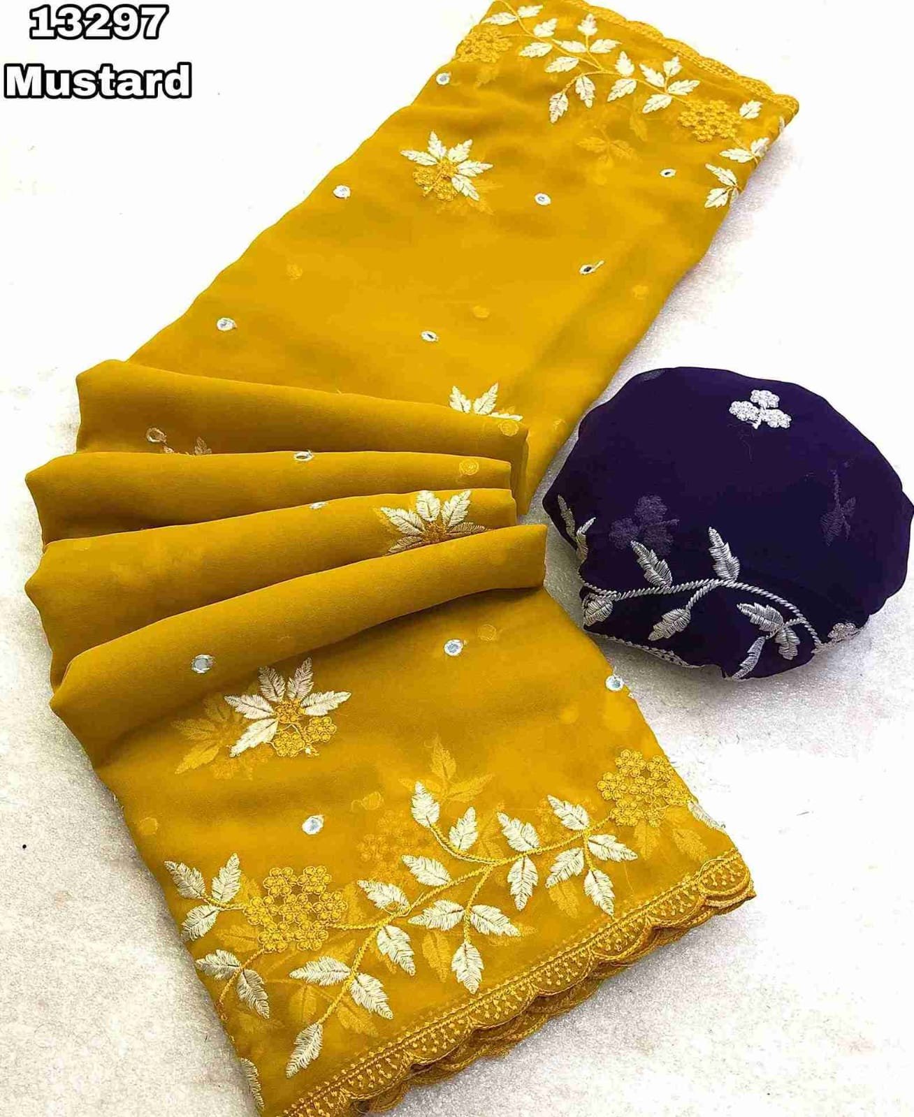 Fabric - Georgette With Floral Design Embroidery With Scalloped Cutwork Border & Foil Mirror Work Allover Blouse - Contrast Embroidery Work Blouse Saree cut - 5.5 meter Blouse cut - 0.8 meter Available in 6 colours Weight - 590 Grams