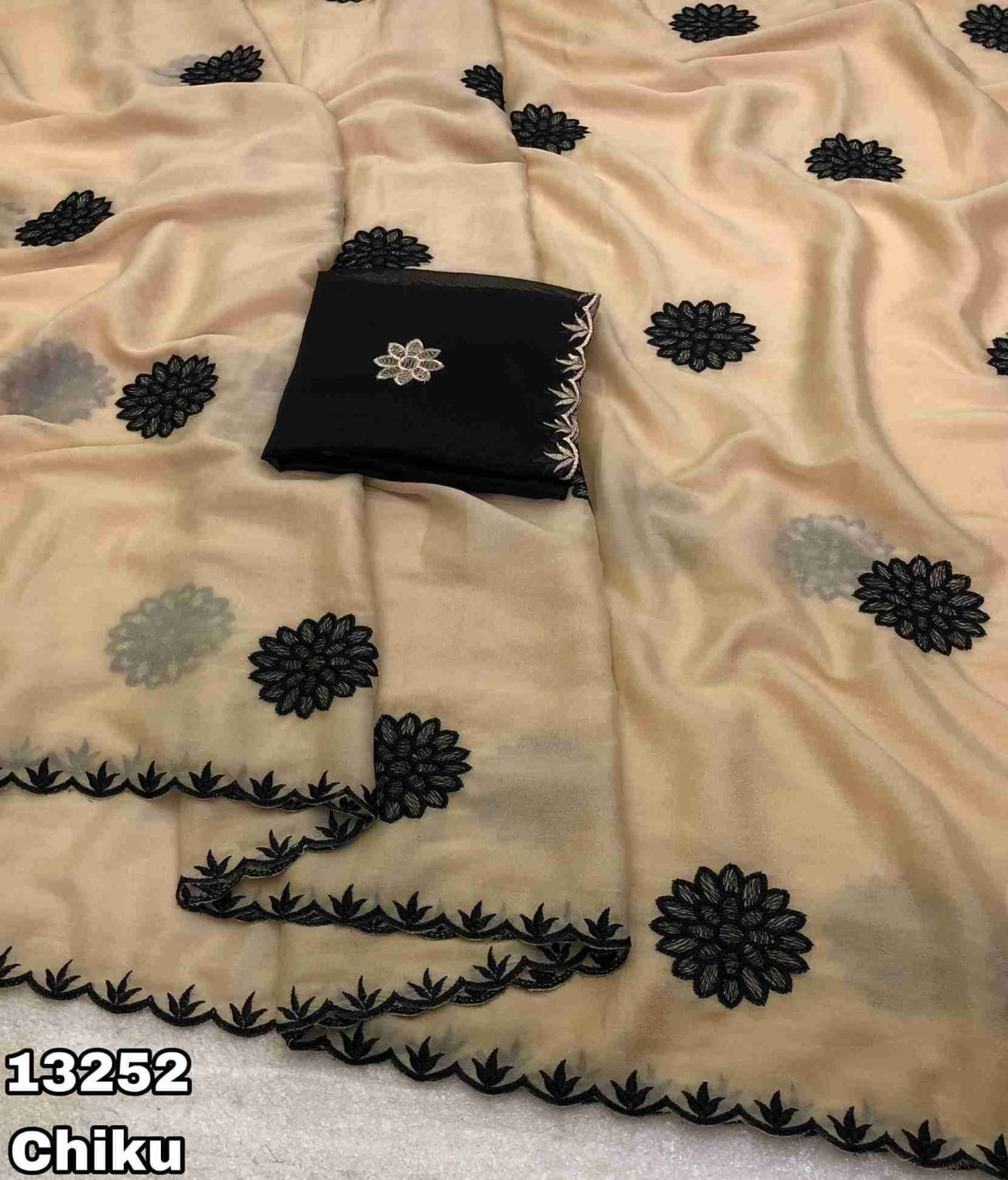 Fabric - Star georgette Embroidery work saree with scalloped cutwork border Blouse - Contrast embroidery work blouse Saree cut - 5.5 meter Blouse cut - 0.8 meter Weight - 550 Grams