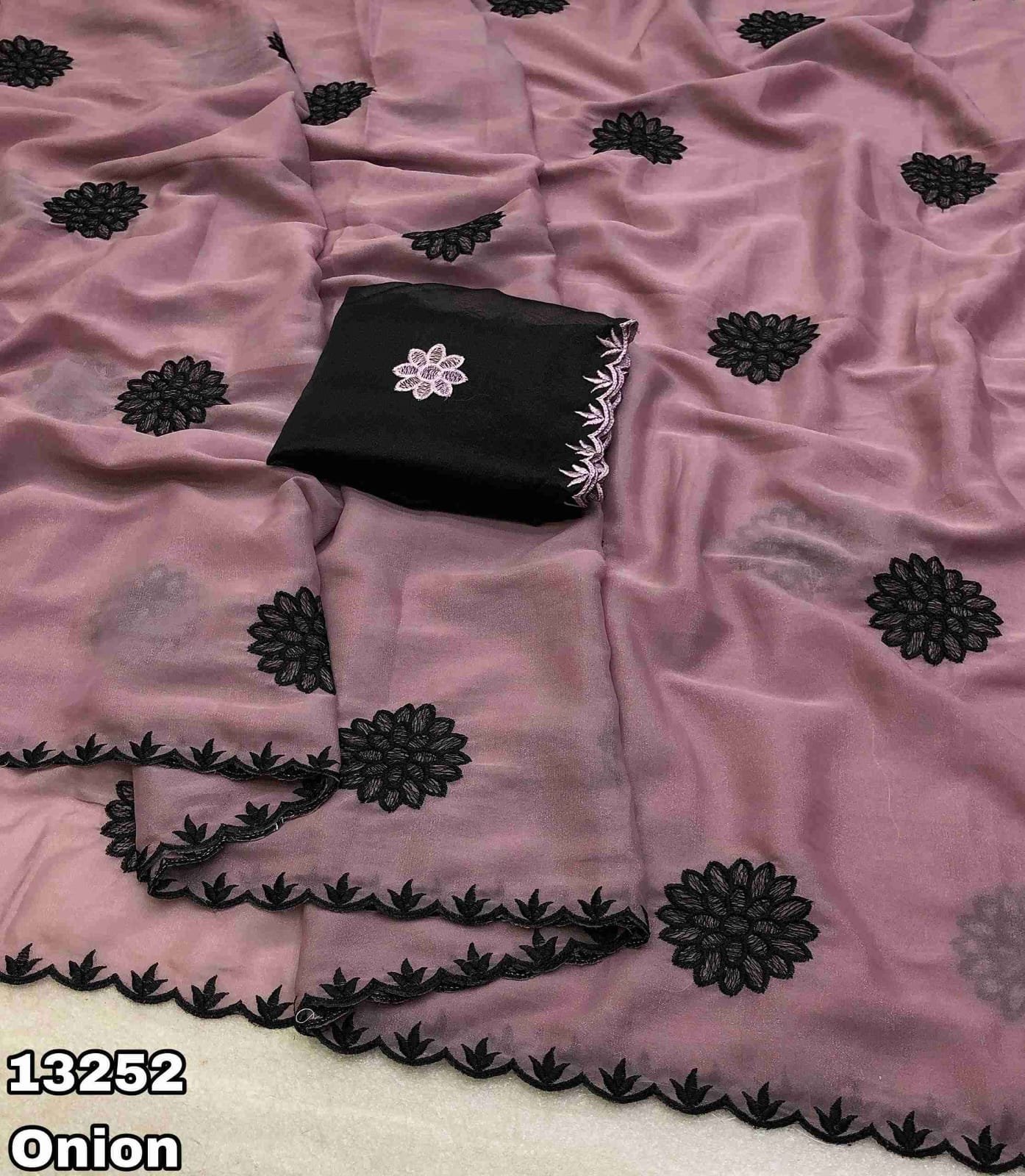 Fabric - Star georgette Embroidery work saree with scalloped cutwork border Blouse - Contrast embroidery work blouse Saree cut - 5.5 meter Blouse cut - 0.8 meter Weight - 550 Grams